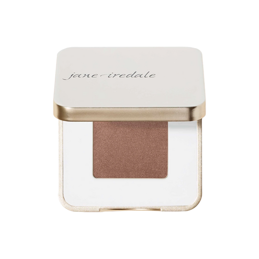 Jane Iredale makeup compact with a brown shade on a white background